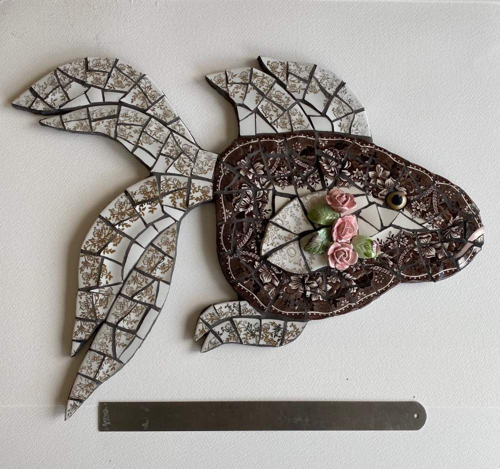 Mosaic goldfish is vintage crockery on cement board for indoors or outdoors. Black grouting. Vintage roses attached.