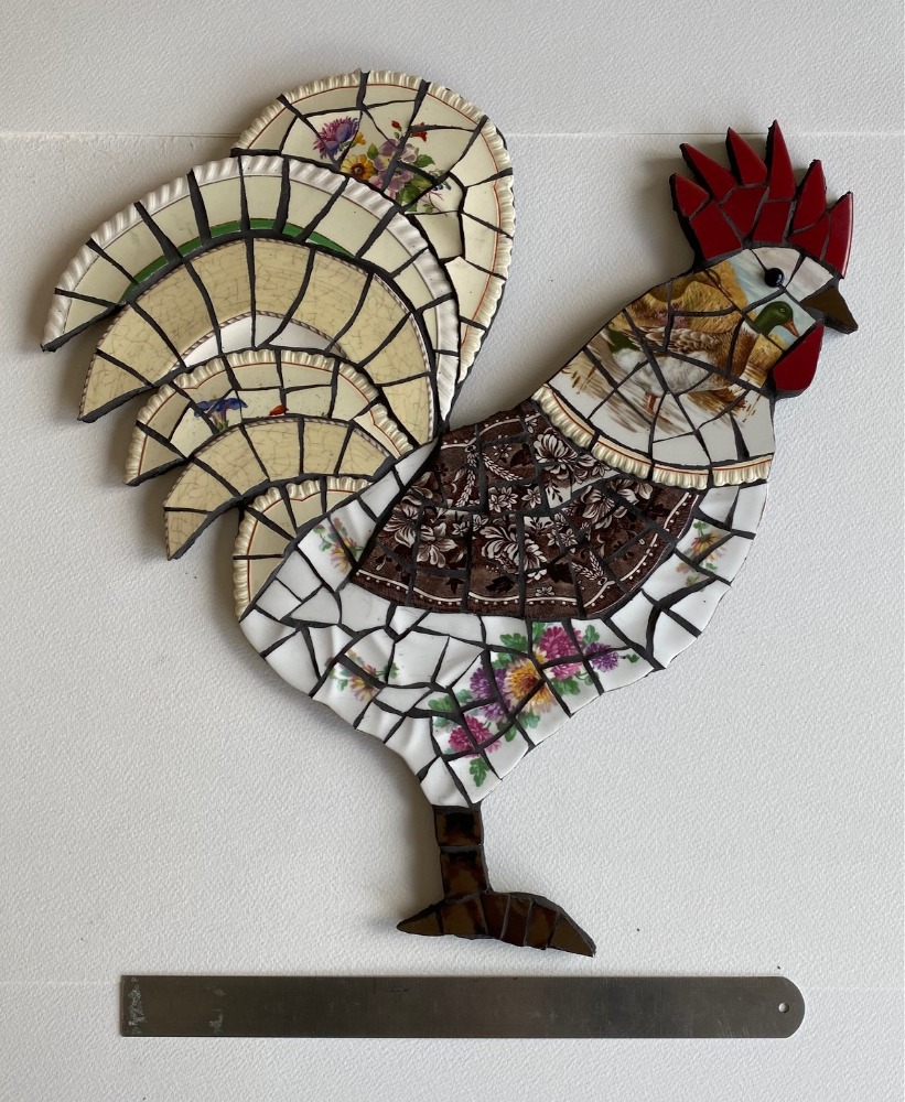 Mosaic rooster is vintage crockery on cement board for indoors or outdoors. Black grouting.