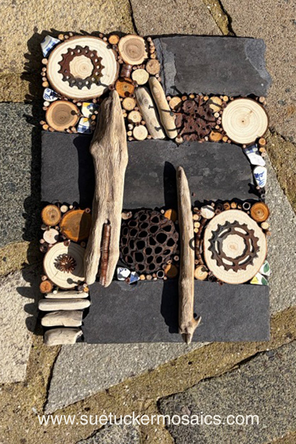 Aerial views of the earth have influenced my collection of mixed-media wall art. These pieces capture the essence of forests, woodlands, farmland, mountains, volcanoes, rock formations, oceans, meandering rivers and streams. Using logs, branches, twigs, driftwood, bamboo, bark, slate, seed pods, shells, moss, stones, and ceramic fragments—along with nails and springs naturally weathered over time.