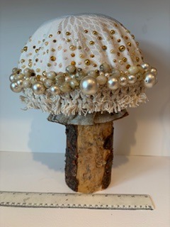 My handcrafted fabric and wood mushroom collection is inspired by the quiet beauty of nature and the magic found in small details. Each piece is carefully made using beautiful upcycled fabrics and finished with delicate beads, giving every mushroom its own unique character. No two are ever the same — just like the natural world that inspires them. From the textures of the wood to the richness of the repurposed textiles, every element is chosen with care to create something truly special.