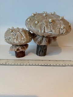 My handcrafted fabric and wood mushroom collection is inspired by the quiet beauty of nature and the magic found in small details. Each piece is carefully made using beautiful upcycled fabrics and finished with delicate beads, giving every mushroom its own unique character. No two are ever the same — just like the natural world that inspires them. From the textures of the wood to the richness of the repurposed textiles, every element is chosen with care to create something truly special.