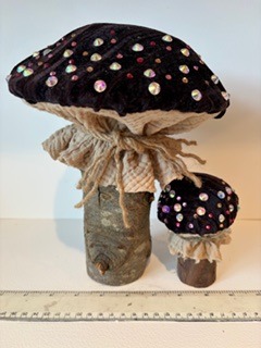 My handcrafted fabric and wood mushroom collection is inspired by the quiet beauty of nature and the magic found in small details. Each piece is carefully made using beautiful upcycled fabrics and finished with delicate beads, giving every mushroom its own unique character. No two are ever the same — just like the natural world that inspires them. From the textures of the wood to the richness of the repurposed textiles, every element is chosen with care to create something truly special.