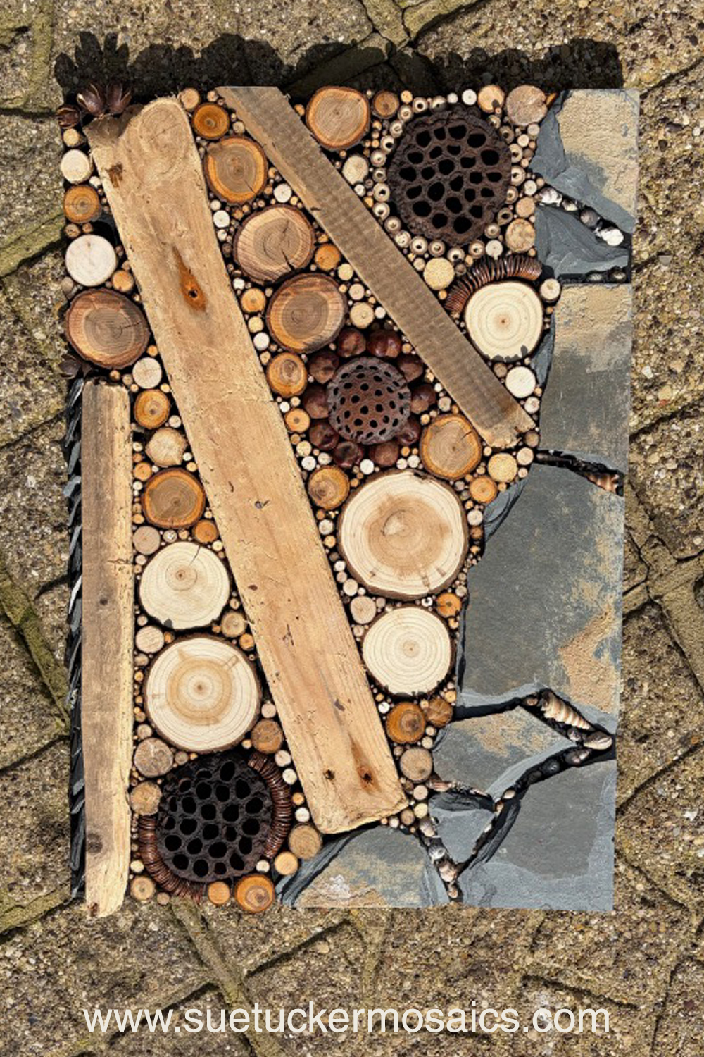 Aerial views of the earth have influenced my collection of mixed-media wall art. These pieces capture the essence of forests, woodlands, farmland, mountains, volcanoes, rock formations, oceans, meandering rivers and streams. Using logs, branches, twigs, driftwood, bamboo, bark, slate, seed pods, shells, moss, stones, and ceramic fragments—along with nails and springs naturally weathered over time.