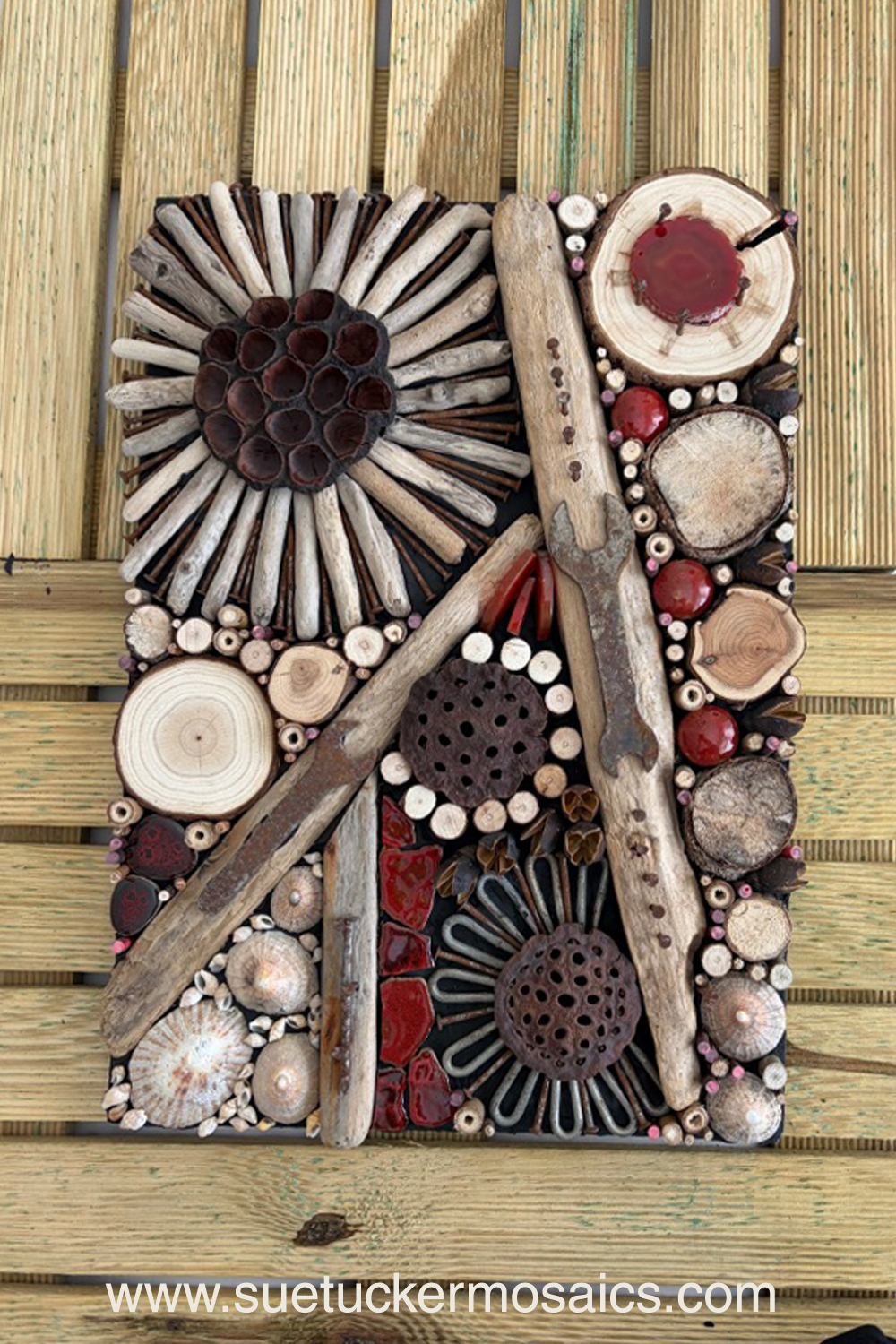 Aerial views of the earth have influenced my collection of mixed-media wall art. These pieces capture the essence of forests, woodlands, farmland, mountains, volcanoes, rock formations, oceans, meandering rivers and streams. Using logs, branches, twigs, driftwood, bamboo, bark, slate, seed pods, shells, moss, stones, and ceramic fragments—along with nails and springs naturally weathered over time.